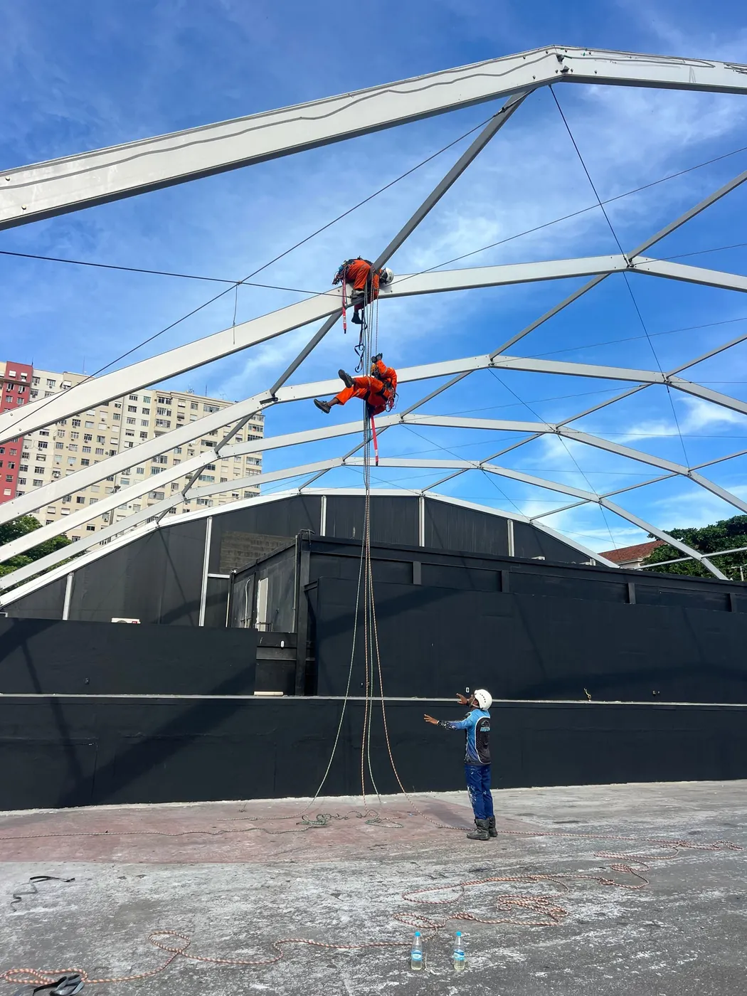 Rope-access work on a roof structure